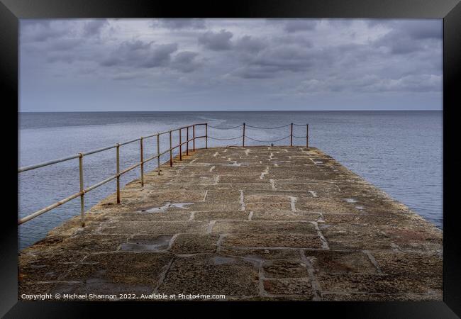 Looking out to sea from the stone pier at Porthlev Framed Print by Michael Shannon