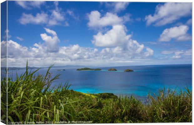 Small islands off Dravuni Island, Fiji, South Pacific Canvas Print by Kevin Hellon