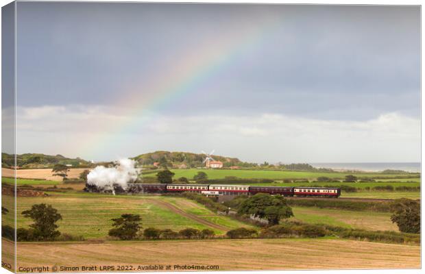 Norfolk steam train with Weybourne windmill and rainbow Canvas Print by Simon Bratt LRPS