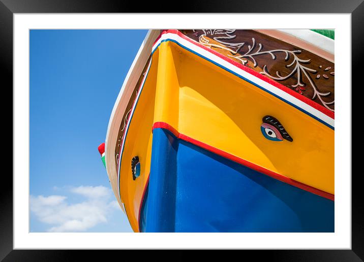 Luzzu boat under a blue sky Framed Mounted Print by Jason Wells