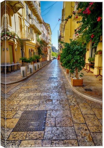 Quiet Street in Corfu Town on THe Greek Island of  Canvas Print by John Gilham