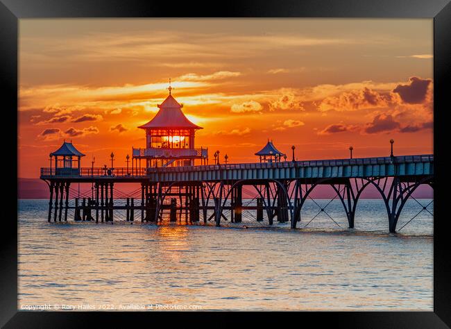 Clevedon Pier at sunset with a colourful horizon Framed Print by Rory Hailes