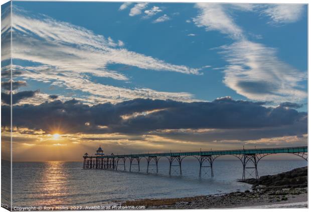 Clevedon Pier with a streak of sunlight going across the channel Canvas Print by Rory Hailes