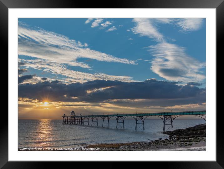 Clevedon Pier with a streak of sunlight going across the channel Framed Mounted Print by Rory Hailes