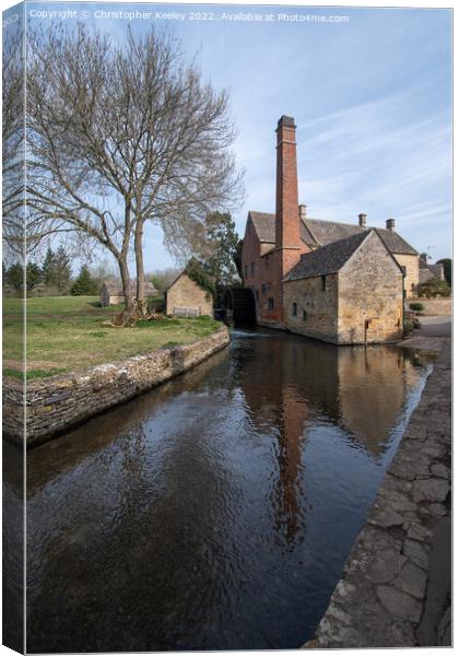 The Old Mill at Lower Slaughter in the Cotswolds Canvas Print by Christopher Keeley