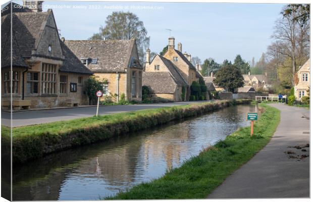 Sunny day at Lower Slaughter in the Cotswolds Canvas Print by Christopher Keeley