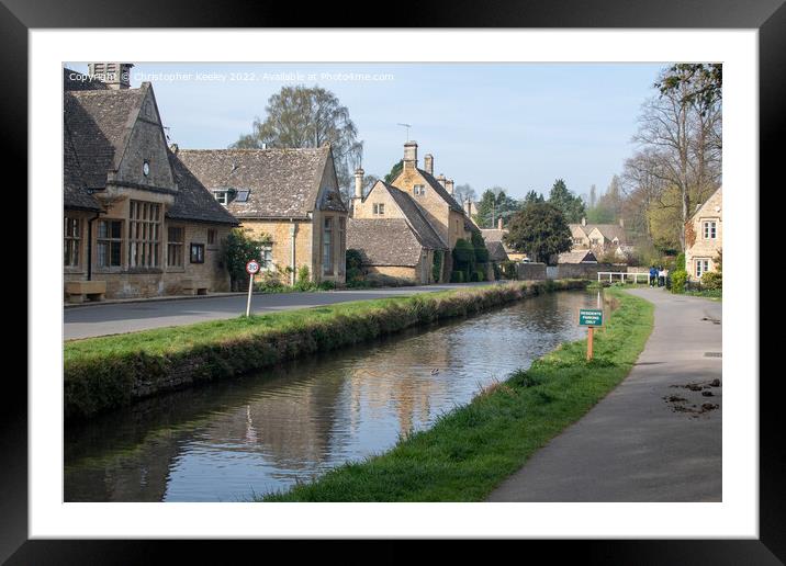 Sunny day at Lower Slaughter in the Cotswolds Framed Mounted Print by Christopher Keeley