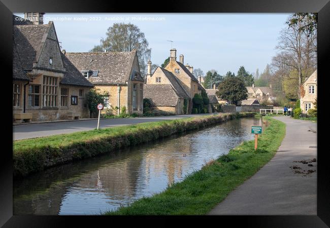 Sunny day at Lower Slaughter in the Cotswolds Framed Print by Christopher Keeley