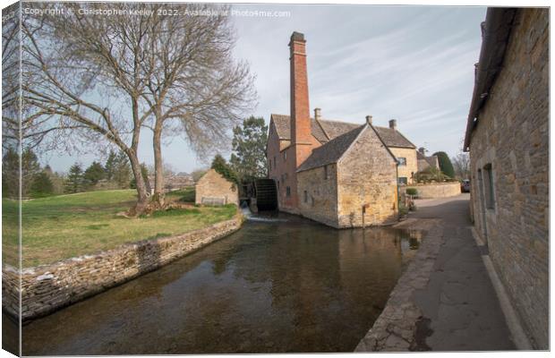 The Old Mill at Lower Slaughter in the Cotswolds Canvas Print by Christopher Keeley