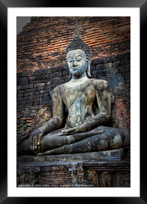 Buddha image,  Sukhothai Historical Park, Thailand Framed Mounted Print by Kevin Hellon