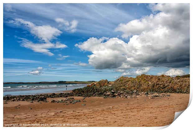 Volcanic rock, blue sky and clouds on Newborough beach, Anglesey Print by Kevin Hellon