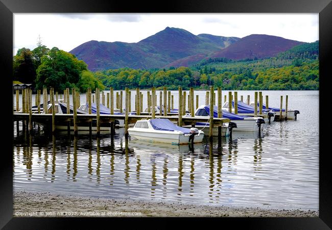 Jetty reflections on Derwentwater Keswick Cumbria Framed Print by john hill
