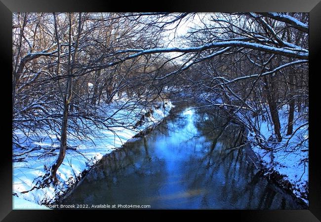Snowy creek with water and trees Framed Print by Robert Brozek