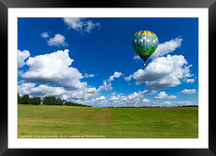 Colorful hot air balloons over green rice field. Framed Mounted Print by Sergey Fedoskin