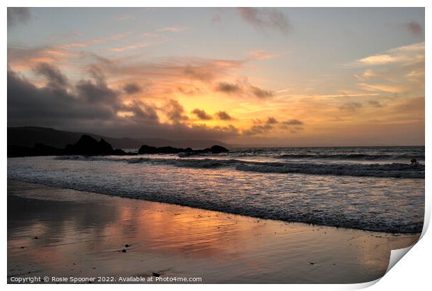 Moody sunrise at Looe Beach Print by Rosie Spooner