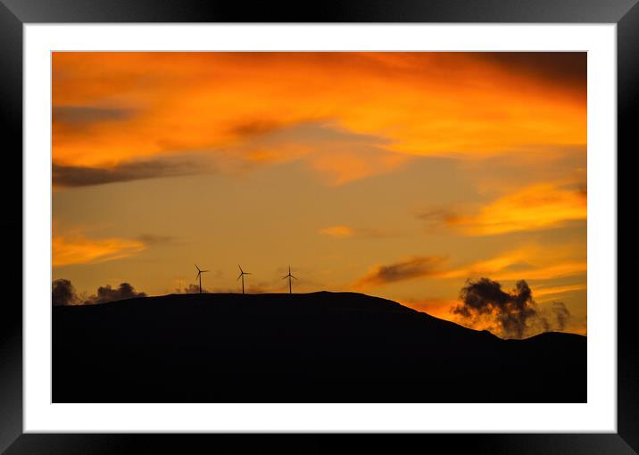 Clean energy power concept with wind turbine on top of a mountain during dramatic sunset Framed Mounted Print by Arpan Bhatia