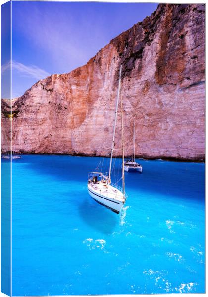 Couple of motor boats anchored on Navagio beach also known as shipwreck beach, Zakynthos island, Greece Canvas Print by Arpan Bhatia