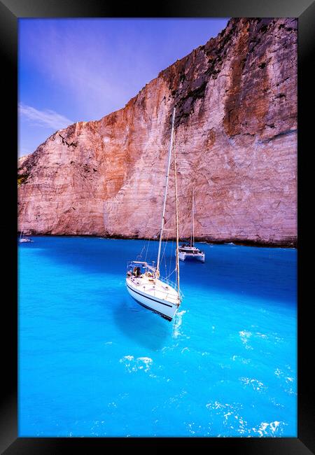 Couple of motor boats anchored on Navagio beach also known as shipwreck beach, Zakynthos island, Greece Framed Print by Arpan Bhatia