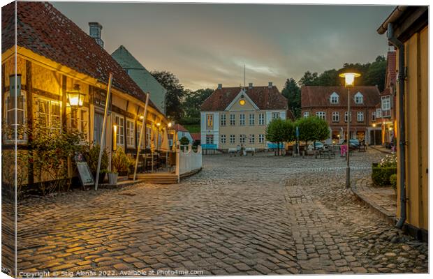 old cobblestone square with a half-timbered hotel in the evening Canvas Print by Stig Alenäs