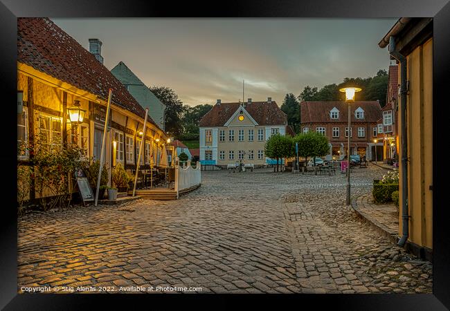 old cobblestone square with a half-timbered hotel in the evening Framed Print by Stig Alenäs