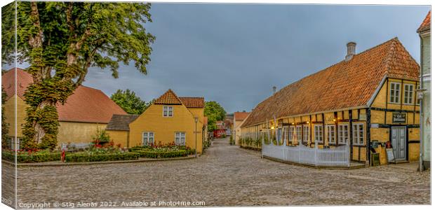 Panoramic wiev of a cobbelstone square and the old timber framed Canvas Print by Stig Alenäs