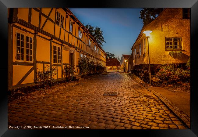 streetlamp at twilight hour in the old cobbled street Framed Print by Stig Alenäs