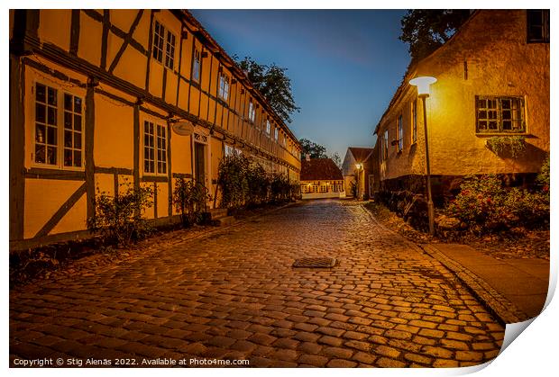 streetlamp at twilight hour in the old cobbled street Print by Stig Alenäs
