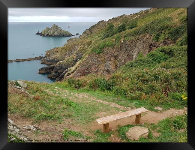 Bench overlooking cliffs Framed Print by Mike Owen