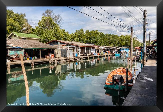 Typical Thai fishing village Framed Print by Kevin Hellon