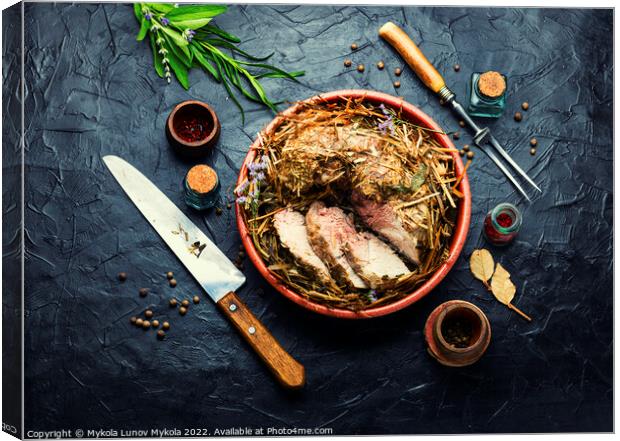 Roast pork in hay with herbs Canvas Print by Mykola Lunov Mykola