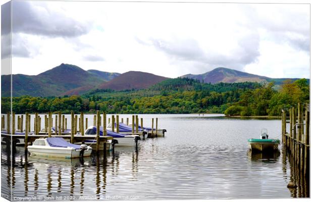 Refections on Derwentwater Cumbria Canvas Print by john hill