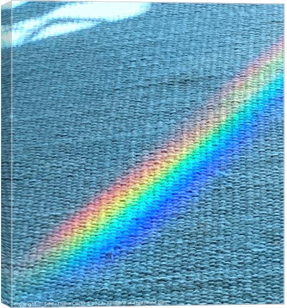 Shaft of prism light over blue rug Canvas Print by DEE- Diana Cosford