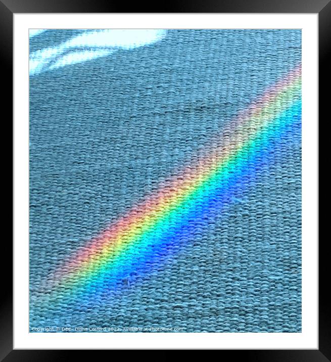 Shaft of prism light over blue rug Framed Mounted Print by DEE- Diana Cosford