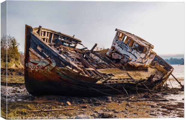Wreck of a wooden fishing boat abandoned Canvas Print by Laurent Renault