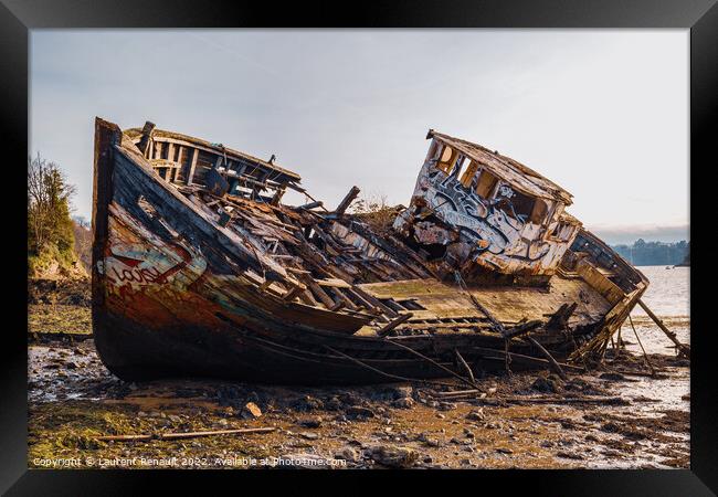 Wreck of a wooden fishing boat abandoned Framed Print by Laurent Renault