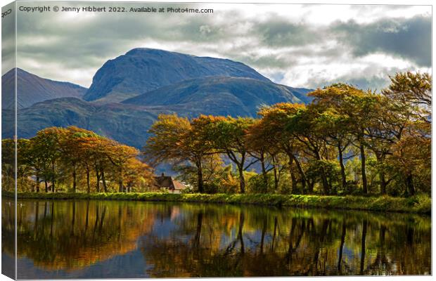 Caledonian Canal with a line of autumnal trees reflecting in the canal Canvas Print by Jenny Hibbert