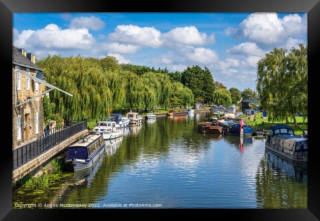 Boats moored on the River Great Ouse at Ely Framed Print by Angus McComiskey