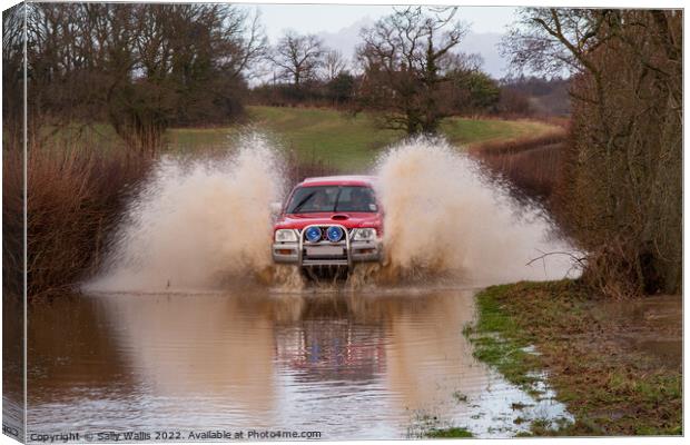 Car travelling at speed through flood Canvas Print by Sally Wallis