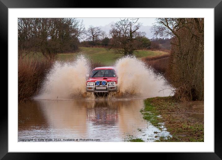 Car travelling at speed through flood Framed Mounted Print by Sally Wallis