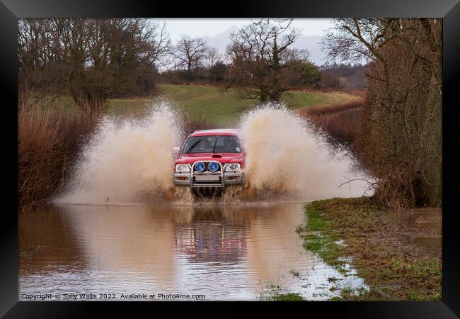 Car travelling at speed through flood Framed Print by Sally Wallis