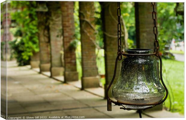 Antique Looking Glass Lantern Hanging from a Rusty Chain.  Canvas Print by Steve Gill