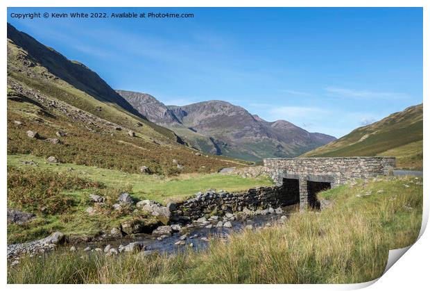 Stream under road bridge at Honister Pass Print by Kevin White