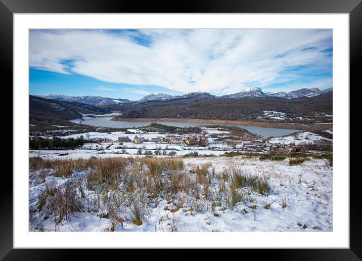 lakeside village in the snow capped mountains Framed Mounted Print by David Galindo