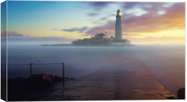 Misty Sunrise at St Marys Lighthouse Canvas Print by Anthony McGeever