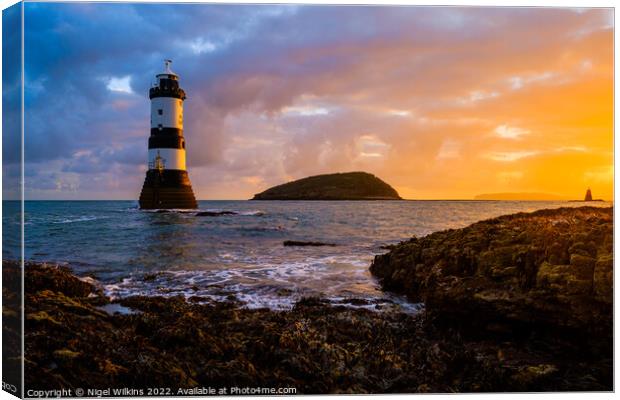Sunrise at Penmon Lighthouse Canvas Print by Nigel Wilkins