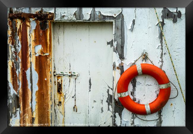 Life belt hanging on the wall of an old boat shed  Framed Print by Delphimages Art