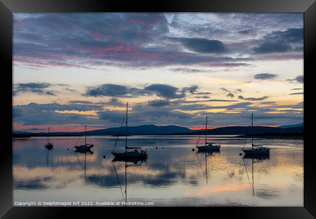 Silhouettes of boats on Loch Etive at sunset, Scot Framed Print by Delphimages Art