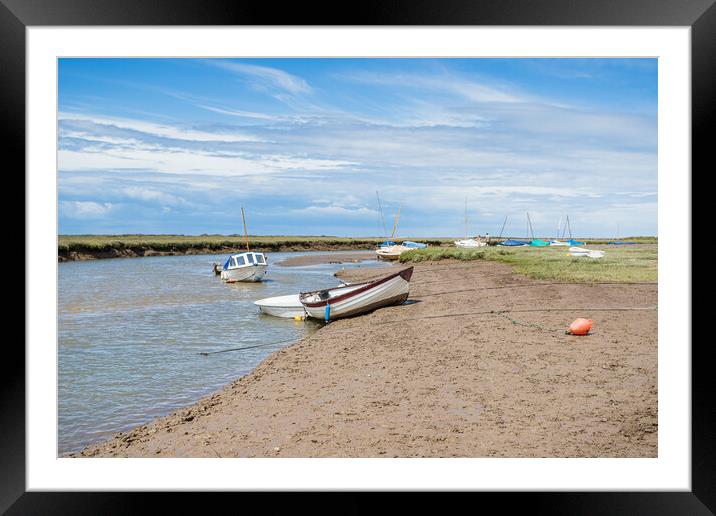 Boats along a channel at Blakeney Framed Mounted Print by Jason Wells