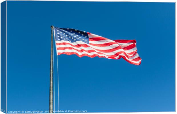 American USA Flag flying on a clear blue sky Canvas Print by Samuel Foster
