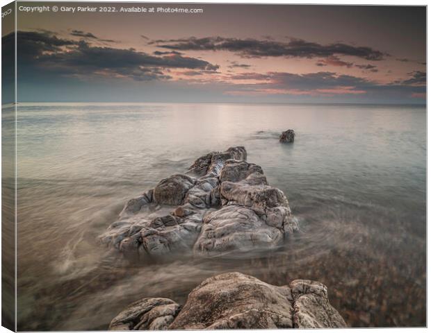 Long exposure on shoreline rocks Canvas Print by Gary Parker